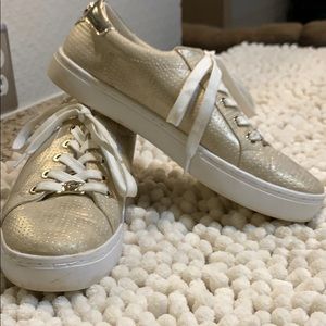 Gold tennis shoes